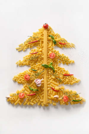 Alternative Christmas tree of different dry pasta and ingredients for Italian cuisine.の写真素材
