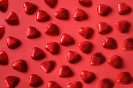 Pattern of red sweets romantic as heart on red. Valentines day background.