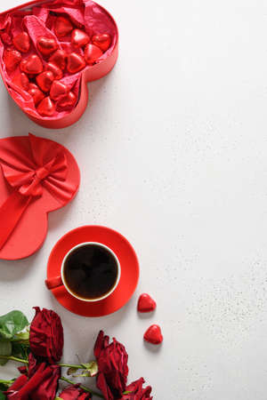 Red hearts chocolate sweets, red roses for Valentines day.の写真素材