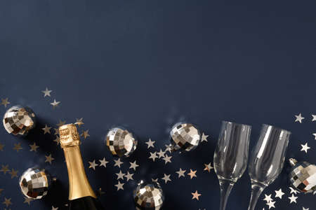 New Year festive champagne, wine glasses on blue.の写真素材