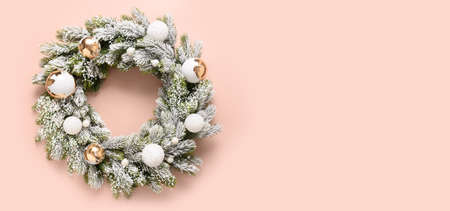 Christmas wreath of snowy branches with white and gold baubles. New Year greeting card.の写真素材