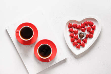 Red hearts chocolate sweets, red roses for Valentines day.の写真素材