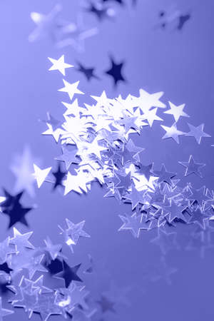 Shiny very peri and violet stars glitter or confetti as monochrome background.の写真素材