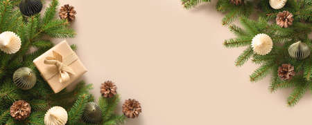 Christmas craft eco gift and festive composition with pine cones on beige background.の写真素材