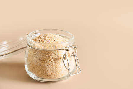 Psyllium husk and glass of water soluble fiber supplement for intestinal.の写真素材