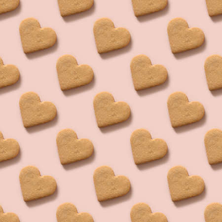 Valentines day seamless pattern with homemade heart shaped cookies.の写真素材