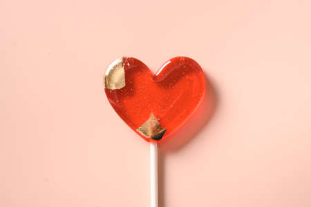 Lollipops pink candy on stick. Valentines day romantic greeting card.の写真素材