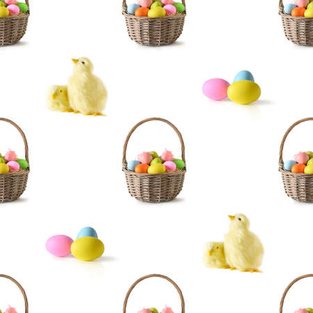 Easter wicker basket with pastel colorful eggs isolated on white.