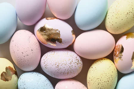 Easter frame with pastel decorative colourful eggs on gray background. Greeting card with copy space.の写真素材