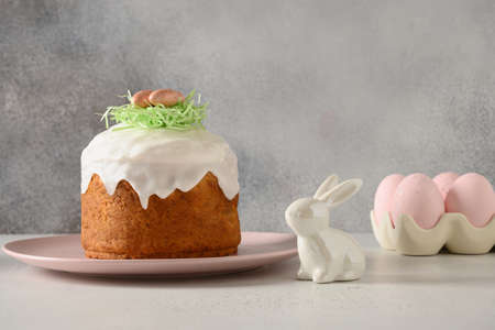 Homemade Easter cake, pink eggs, easter rabbit for celebration religion custom.
