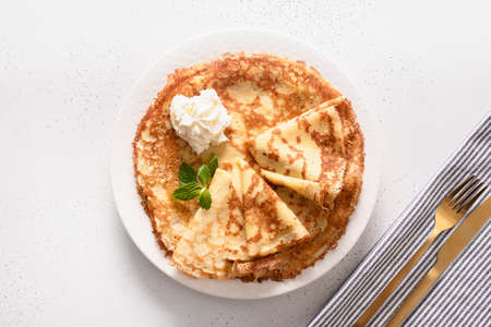 Russian traditional thin pancakes or blini on white background.の写真素材