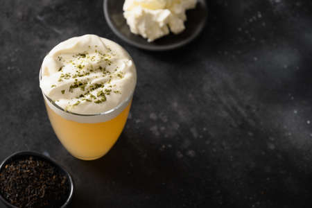 Cheese tea made with whipped cream cheese foam.の写真素材