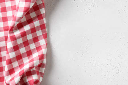 Kitchen white table with red checkered towel. Top view. Flat lay. Space for your design, recipe or menu.の写真素材