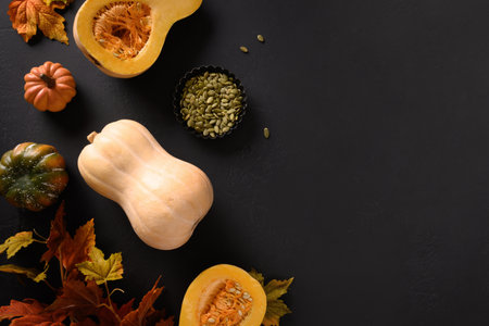 Ingredients for homemade cooking Autumn Pumpkin Pie and on black background. View from above. Copy space.の写真素材