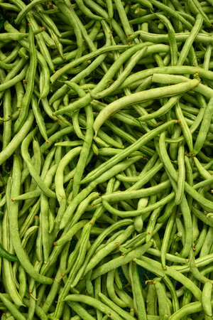 Fresh green bean on market as background. Top view. Organic texture. Local food and vegetables. Agriculture. Indonesian fresh harvest.の写真素材