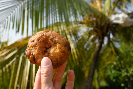 Ulundu Wade spicy lentil fritters made from combination of dhal, onion, chilli, curry leaves and seasoning. Ulundu wade is soft on inside and crunchy on outside. India and Sri Lanka street food.の写真素材