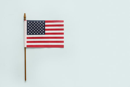 American flag on blue background with copy space. USA Independence Day concept. Flat lay, top view.の写真素材