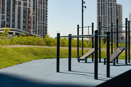 Modern sports playground or gym park for fitness exercises in the city at summer. Outdoors. Public...