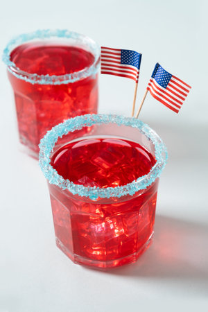 Celebratory red margarita cocktails on gray background. Vertical format. Close up. Independence Day of July 4th.の写真素材