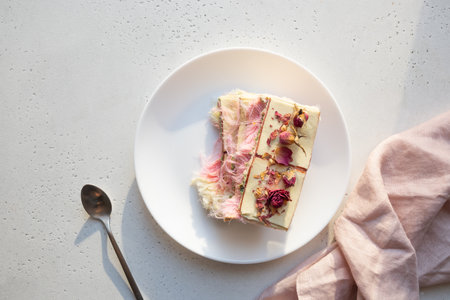 Tasty trendy dessert handicraft chocolate with airy filling white and pink pismaniye on white table....