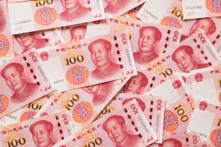 Many of different Chinese yuan banknotes. Chinese paper currency Yuan renminbi banknotes as...