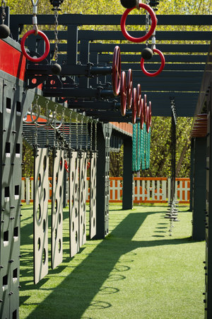 Gymnastic rings on playground for kids and adult. Outdoor sports activities. Outside gym at city...