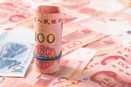 Roll of Chinese yuan 100 banknotes. Chinese paper currency Yuan renminbi banknotes as background. Close up.の写真素材
