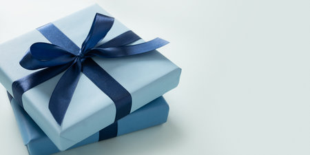 Banner with two blue gift boxes on pastel blue background. Greeting card, flyer or invitation. Close up. Copy space. Happy Fathers Day.の写真素材