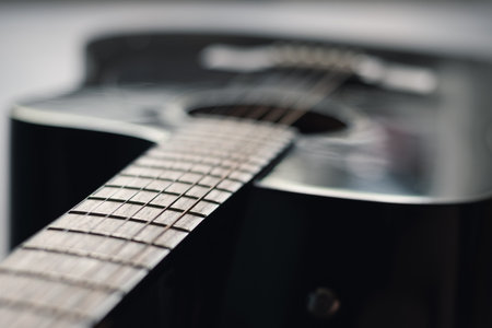 Dark acoustic guitar. Musical instrument. Close upの写真素材