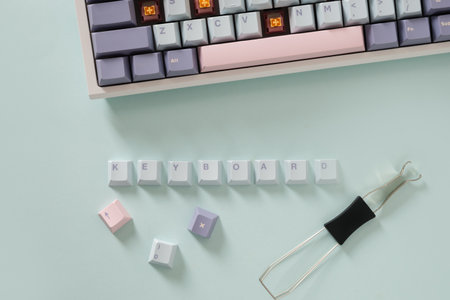 Concept cleaning and customization keycaps in modern mechanical keyboard on blue background. Custom...