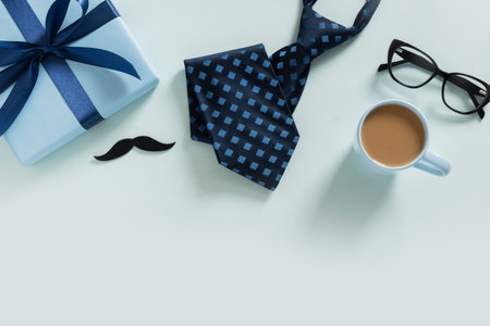 Happy Fathers Day frame. Greeting card with gift, coffee cup, necktie, glasses on blue background....