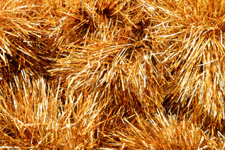 Golden tinsel Christmas tree as abstract festive background. Xmas holiday pattern.の写真素材