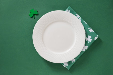 St Patricks day table setting on green background