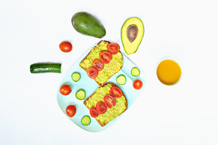 sandwich with avocado and tomato with cucumberの写真素材