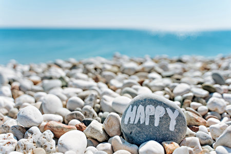 stones on the beach with a blue seaの写真素材