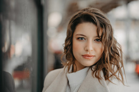Beautiful young brunette girl close portrait looking in cameraの写真素材