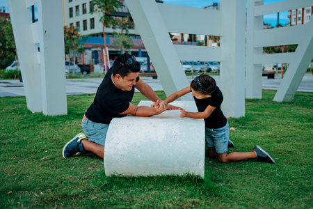 Father and son playing and having fun doing sport together. Concept of happy family and of summer vacationの写真素材