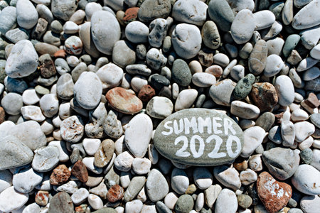 Stones on the stone beach and the inscription summerの写真素材
