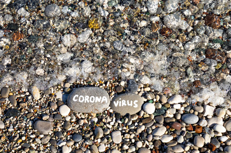 stones on the beach in sea and the inscriptionの写真素材