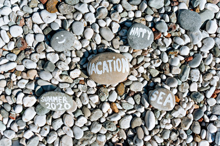 stones on the beach with a blue seaの写真素材
