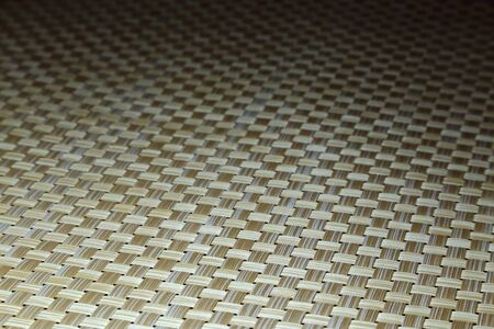 Background woven beige shaded with texture, with perspective and diagonals
