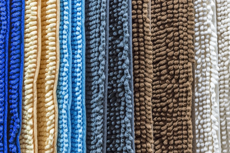 Carpet, rug, blanket. Abstract striped background of new home multi-colored door carpets for home with a textile textureの写真素材