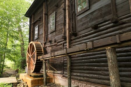 Historical ancient landmarks of the Saratov region, Russia. Old restored wooden water mill of the...