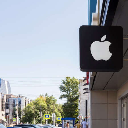 Saratov, Russia - 08/24/2019: Sign on a store with the logo of the popular Apple company, outdoor...