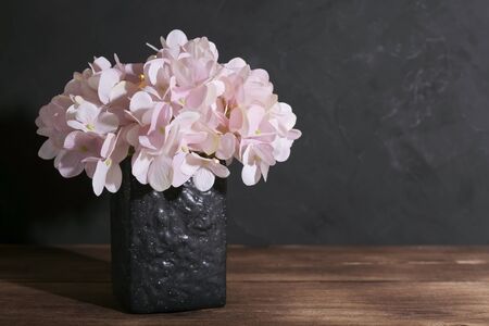 Floral beautiful artistic still life, design and interior details. Artificial pink hydrangea in a...