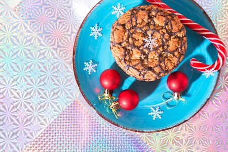Christmas holiday cookies homemade sweet dessert on a blue plate and attributes New Year symbols on...