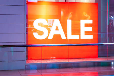 Promotional neon sign lettering orange red sale in store in big mallの写真素材