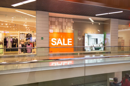 Saratov, Russia - 10/04/2020: Advertising neon sign inscription Sale in orange red in a store in a large shopping centerのeditorial素材