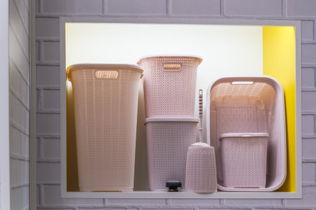 Assortment of Plastic Containers for Storing Things and Organizing Home Space and Interior Decor, Laundry Baskets, Boxes, Garbage Bucket, Household Goods for Sale in the Store on the Shelf Retailの写真素材