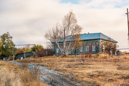 Life in the village, the road to housing for self-isolation in quarantine, one lonely suburban wooden secluded house on a hill in Russia in the Saratov region in isolation periodの写真素材